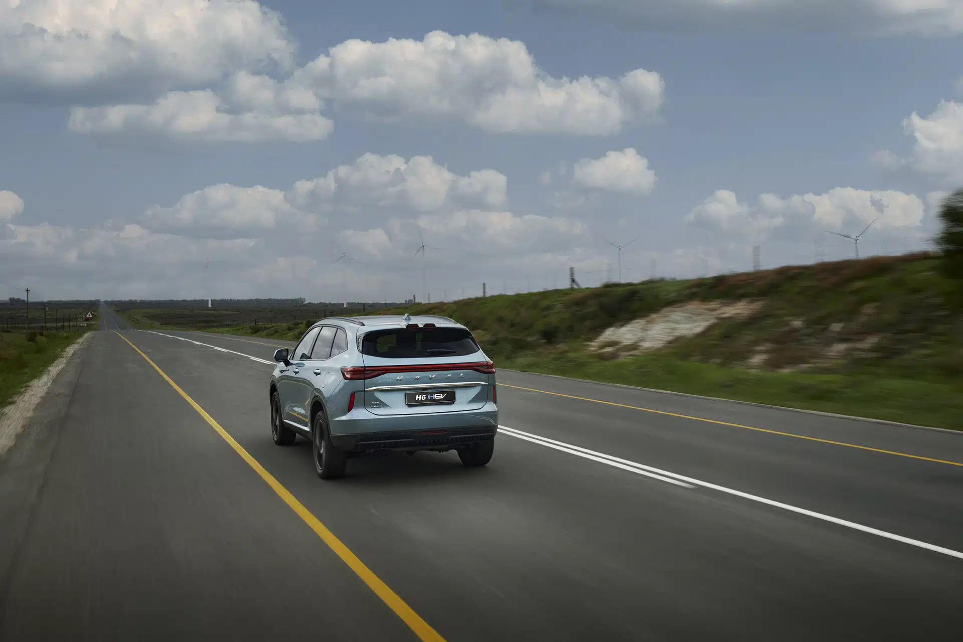 Rear view of Haval HEV GT on the road