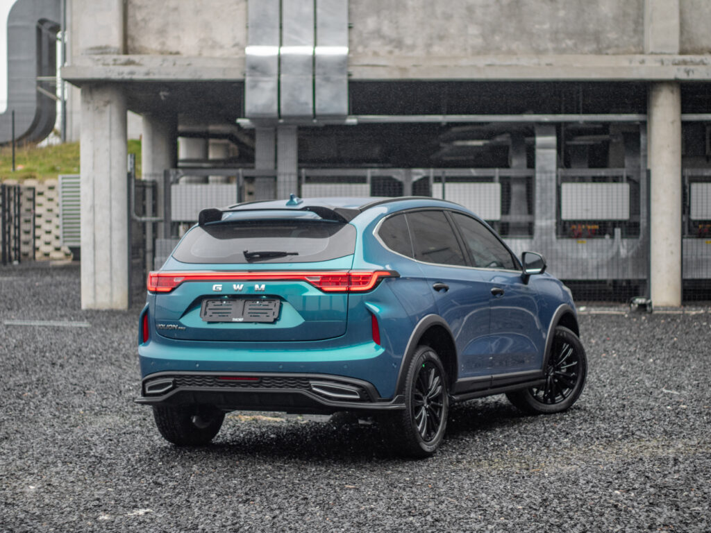Blue Haval Jolion Pro shot from the back in an urban setting